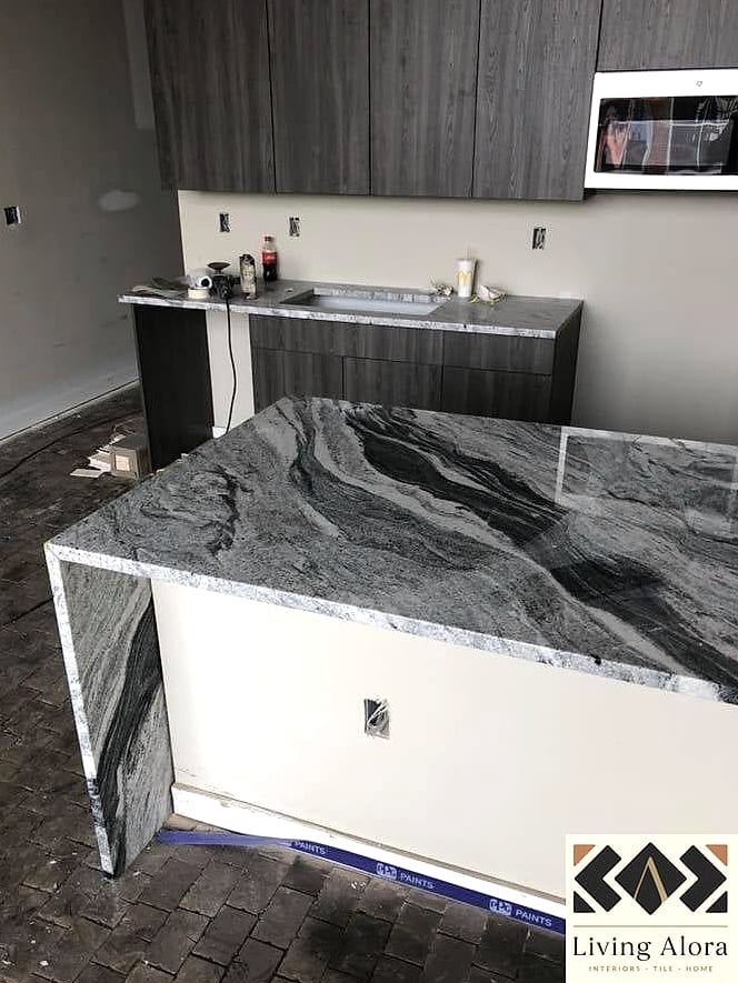 18 Granite Backsplash Ideas That Will Transform Your Space 17 Granite Backsplash with a Waterfall Edge
