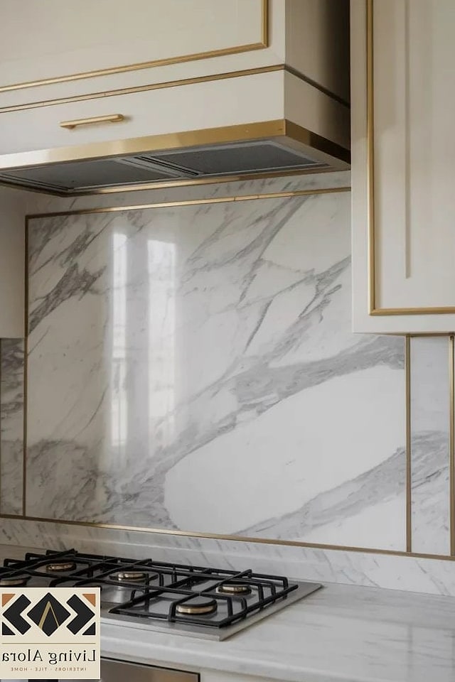 Marble Backsplash with a Brass Inlay